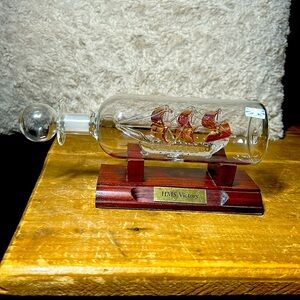 VTG Spun Glass HMS Victory Ship in a bottle with wood stand 24 K Gold blown